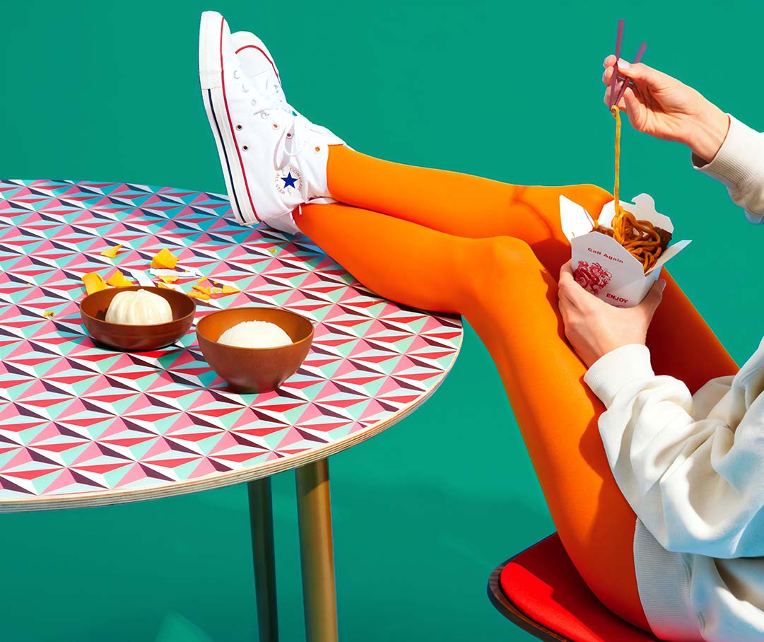 Woman Eating with Feet up on the Table 1